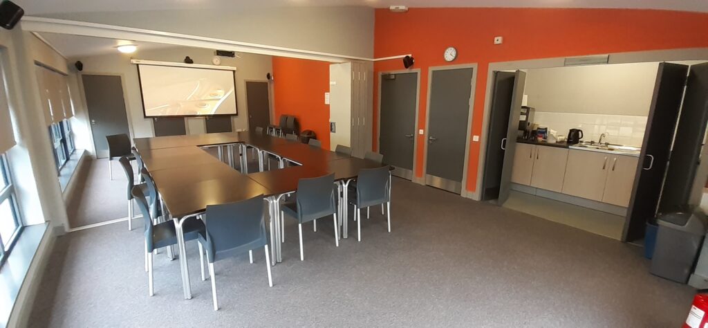 Photograph of the meeting rooms setup for metting